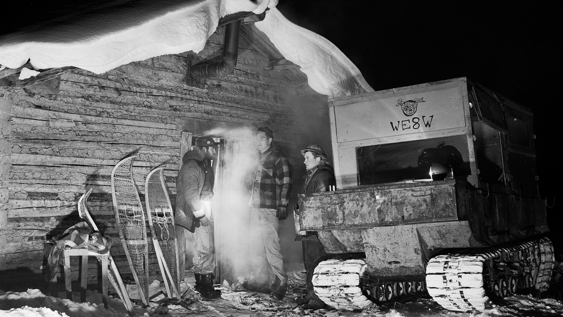Historical photo of Alaskan oil workers at cabin.