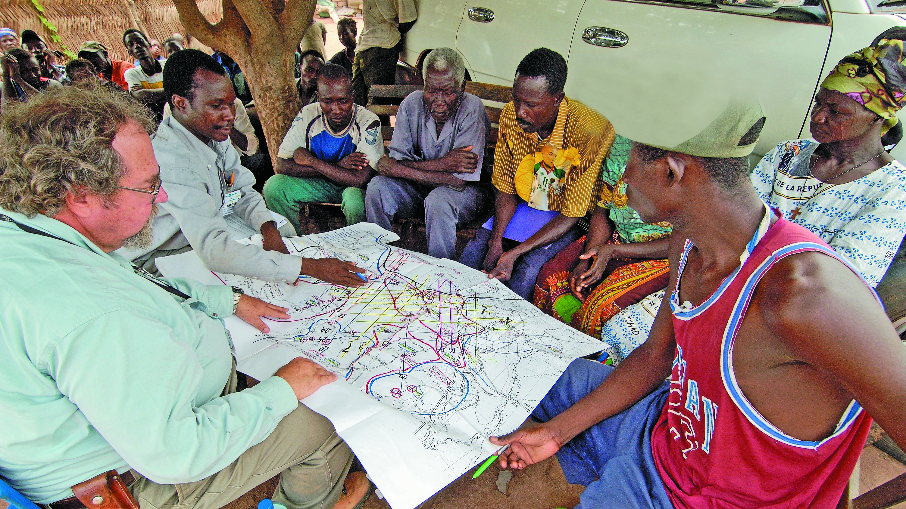 Community members consulting a map