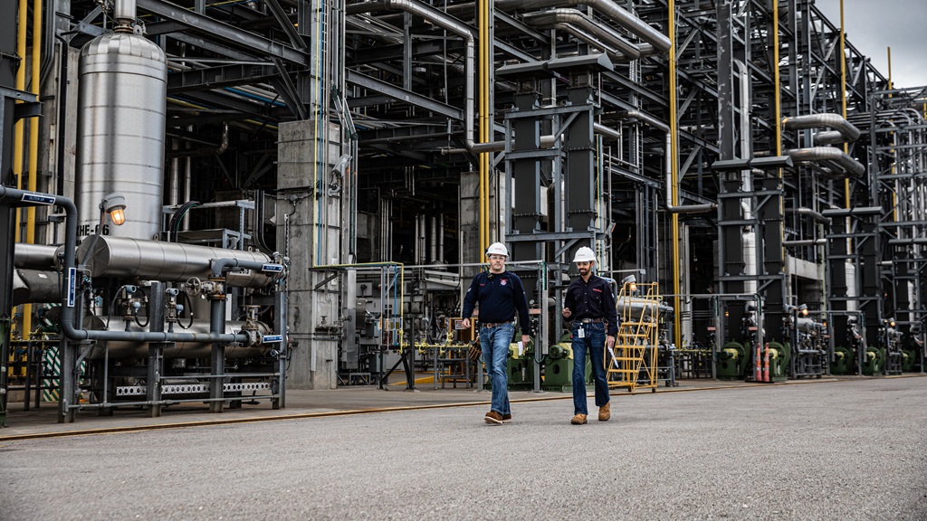 ExxonMobil employees walking in the Baytown, Texas refinery.