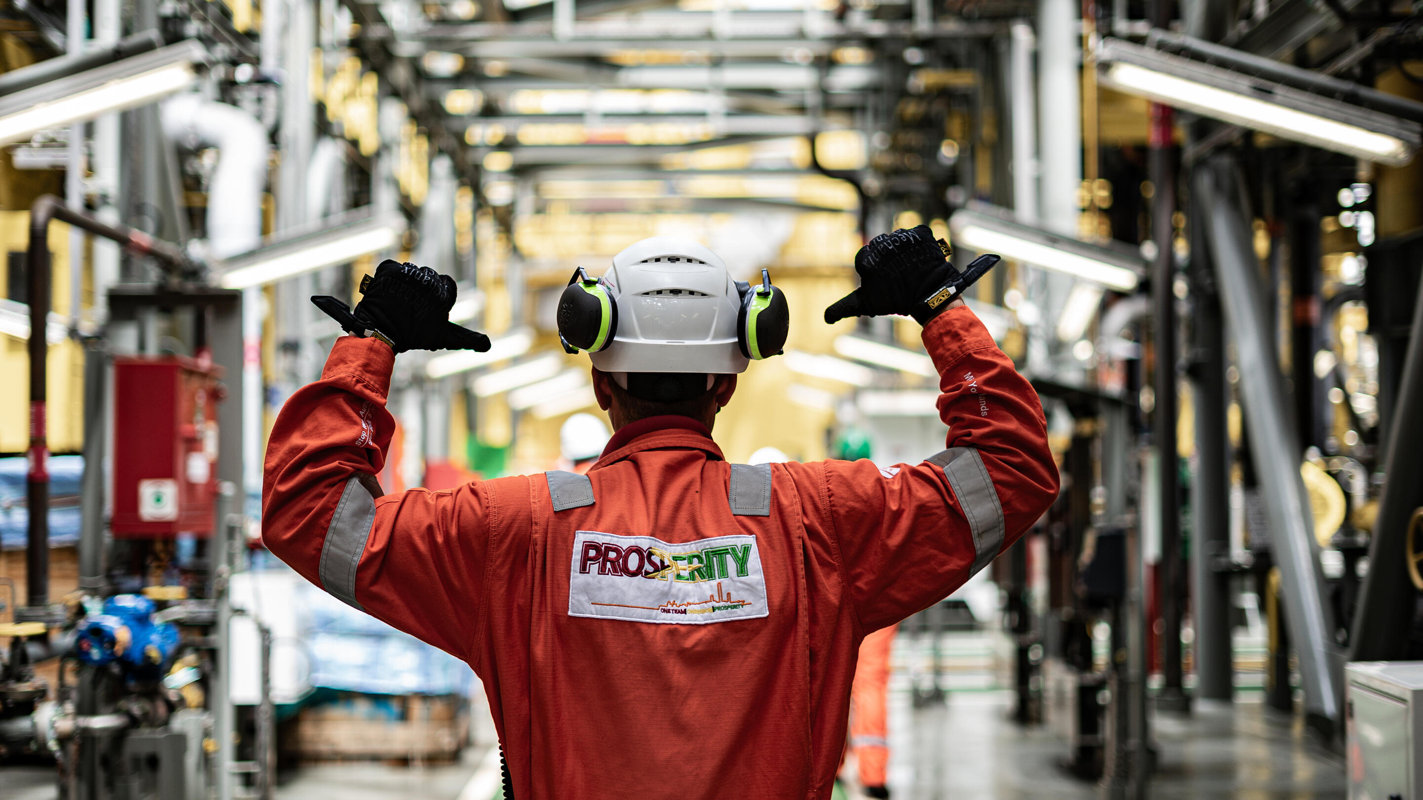 back of a local worker in protective gear