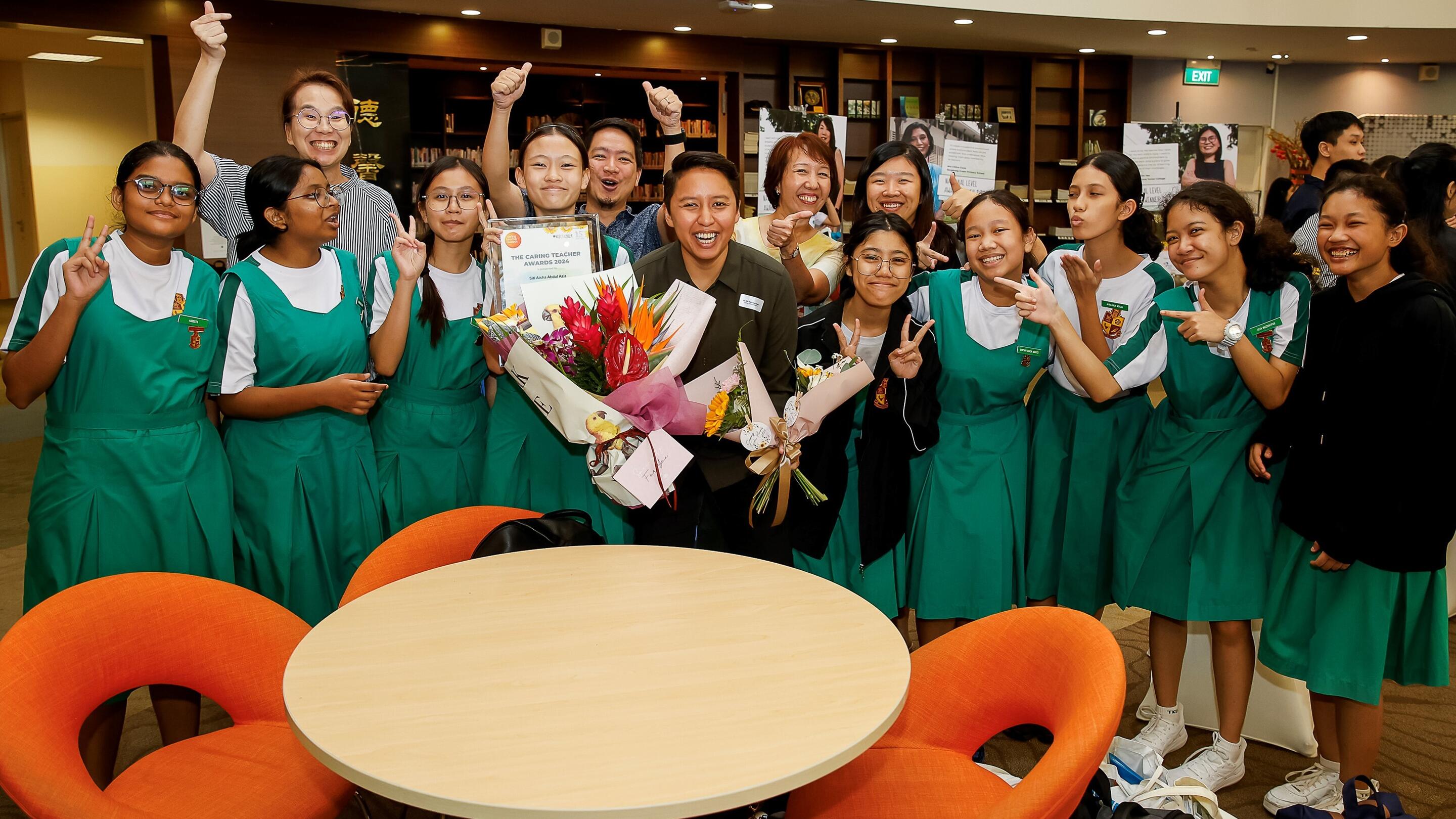 2024 Caring Teachers award recipient with students (Singapore)