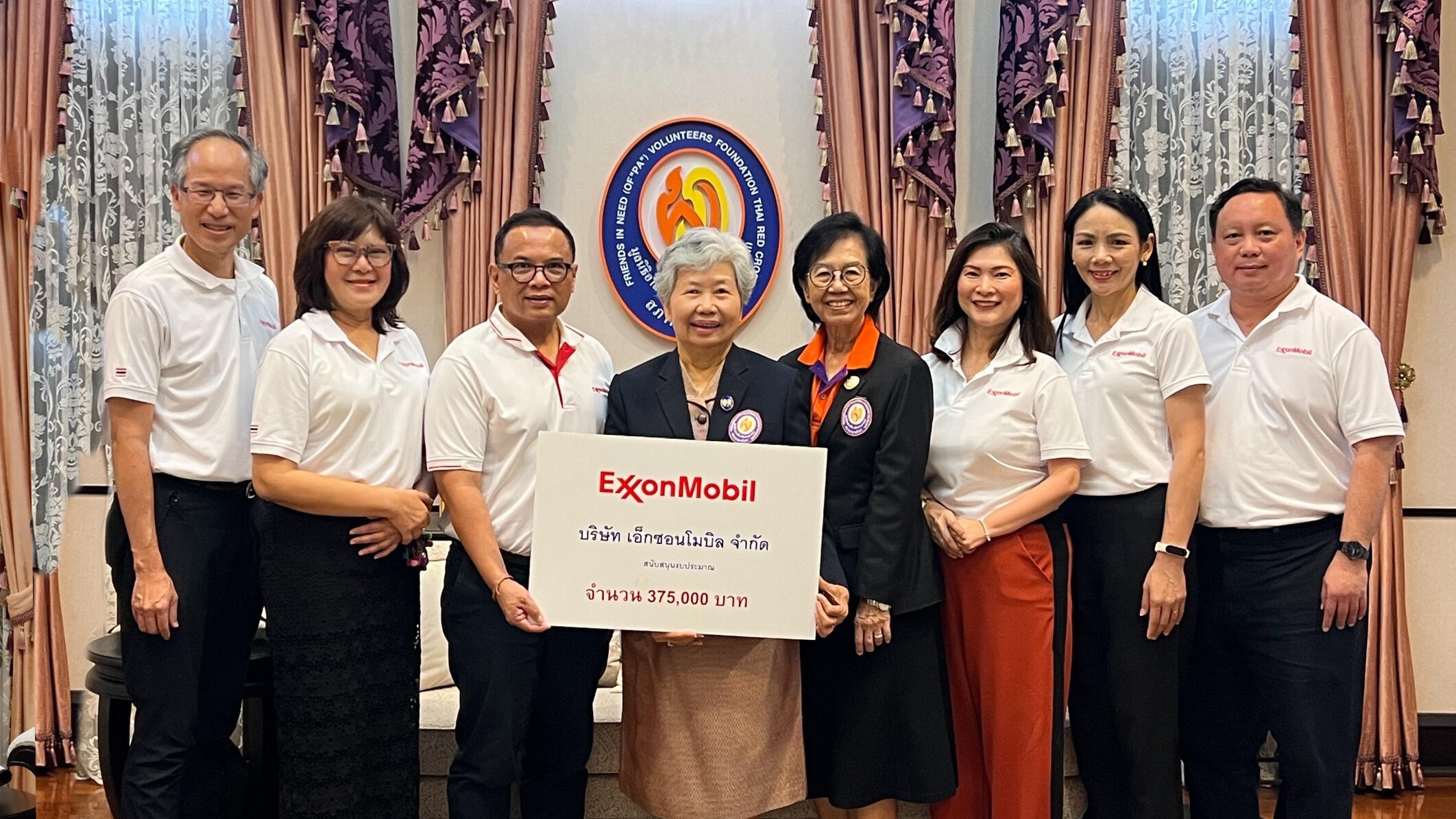 group photo for presentation of donation to Friends in Need (of