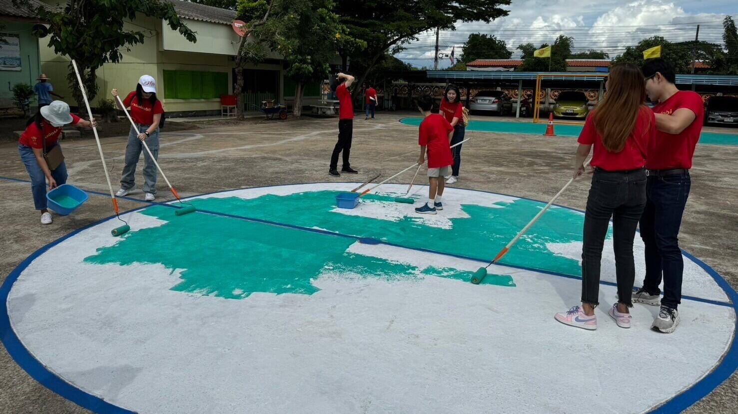 volunteers painting school campus