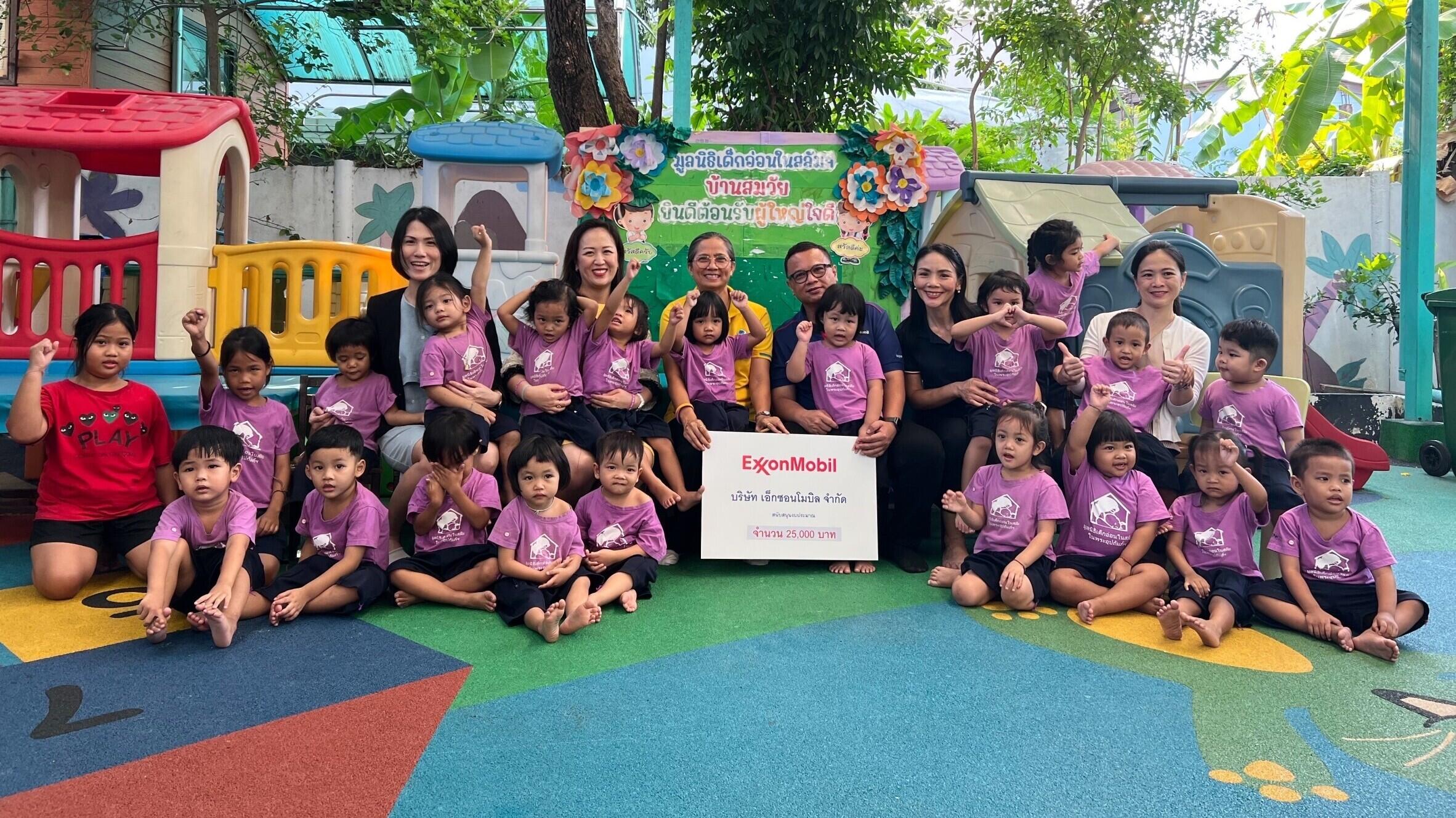 presenting a contribution to the foundation that runs four daycare centers for disadvantaged children