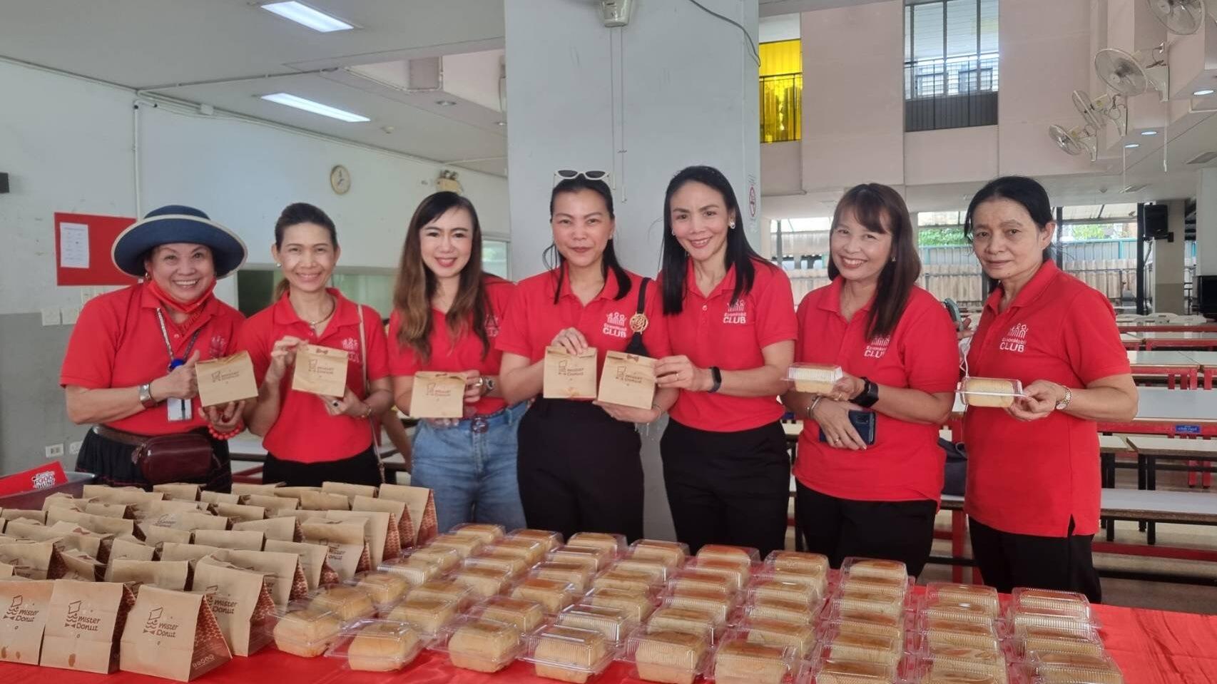 employees pose with donations for Foundation