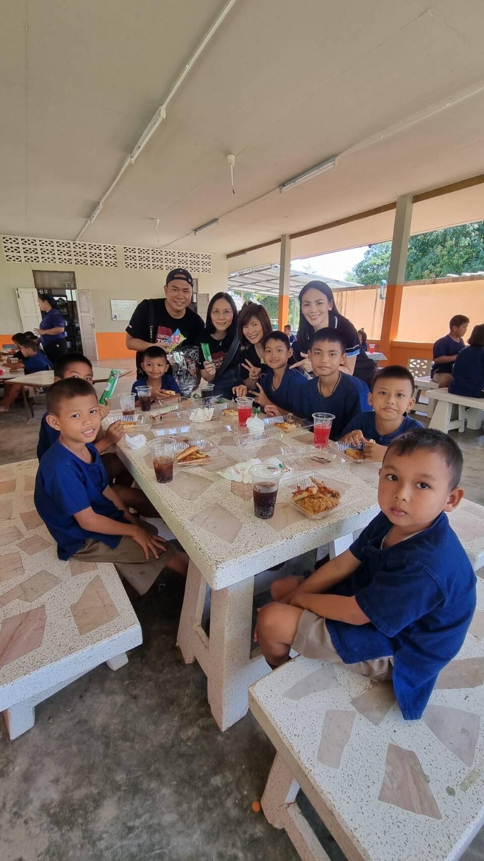 A few ExxonMobil Thailand employees with Baan Nong Pai School students