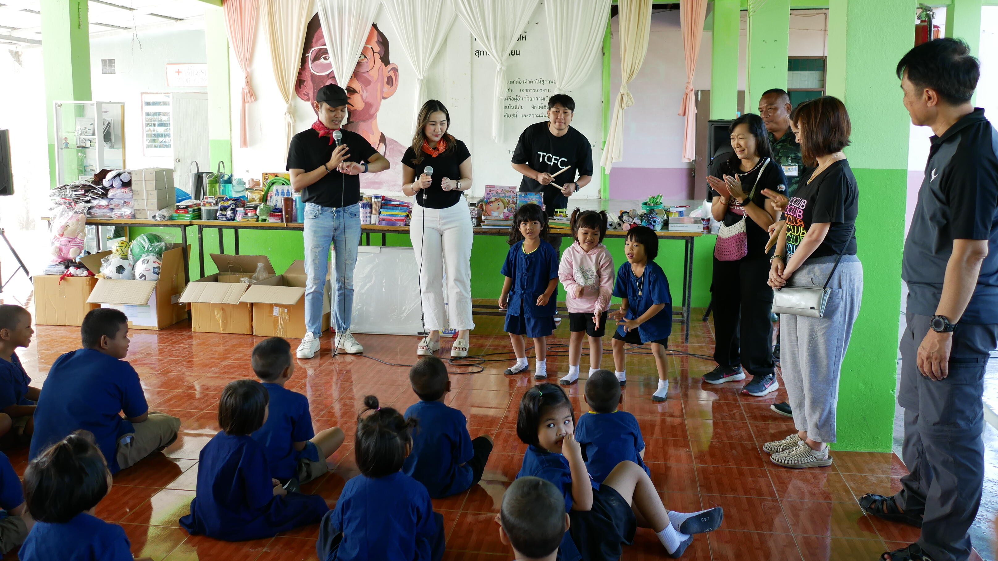 small group of ExxonMobil Thailand employees and young Baan Nong Pai school students