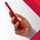 Hand holding a red smartphone