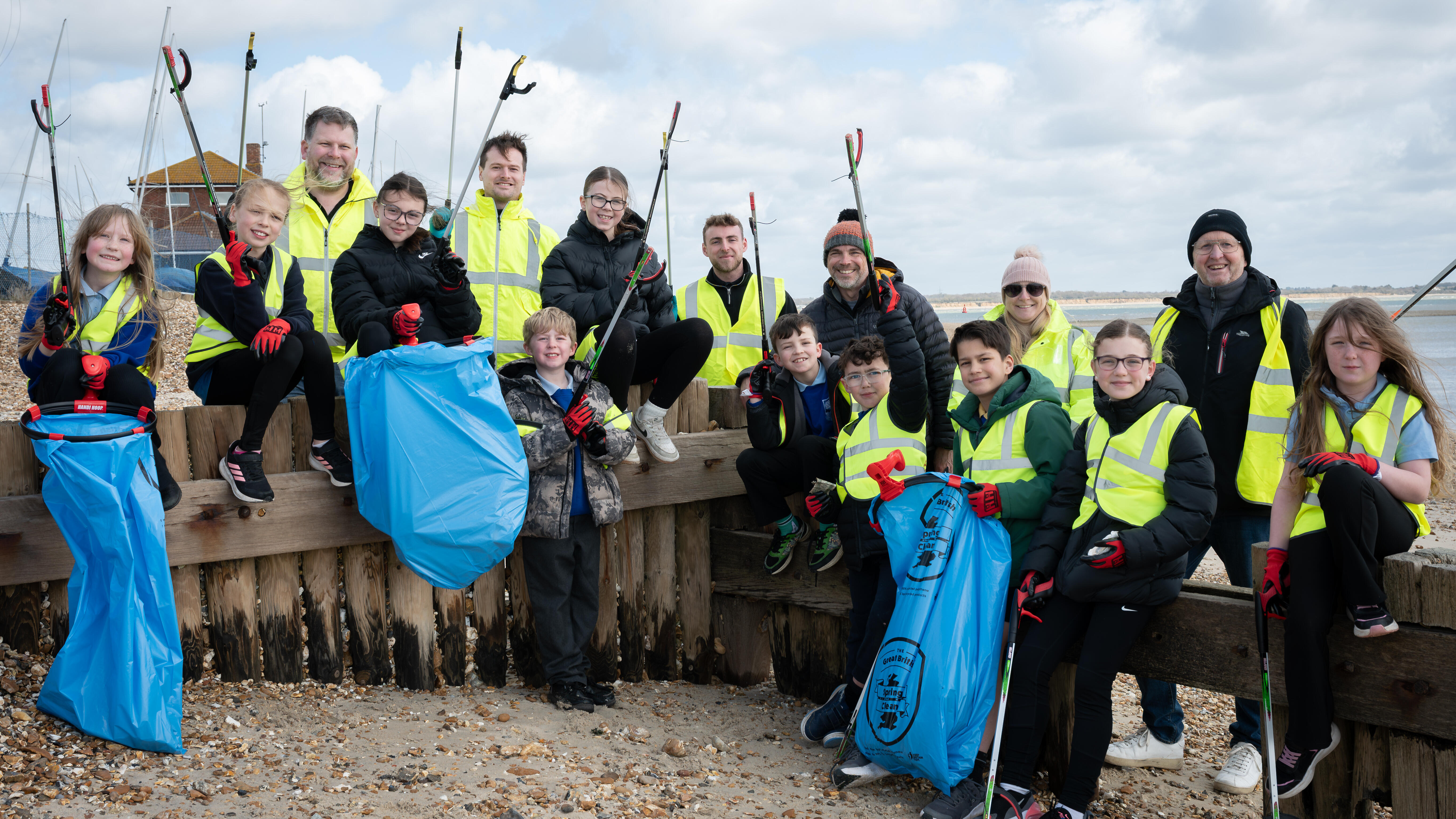 ExxonMobil Fawley employees and local students cleaning up Calshot Beach