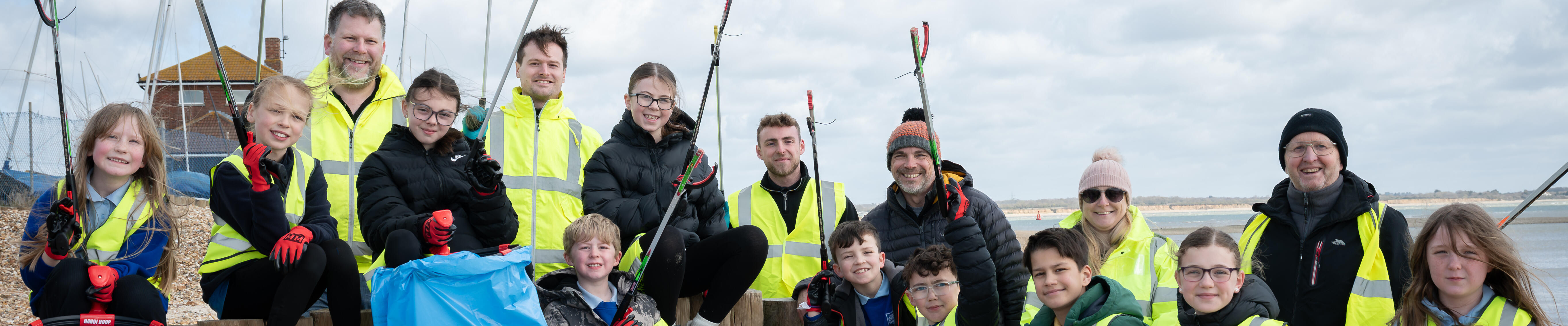 ExxonMobil Fawley employees and local students cleaning up Calshot Beach