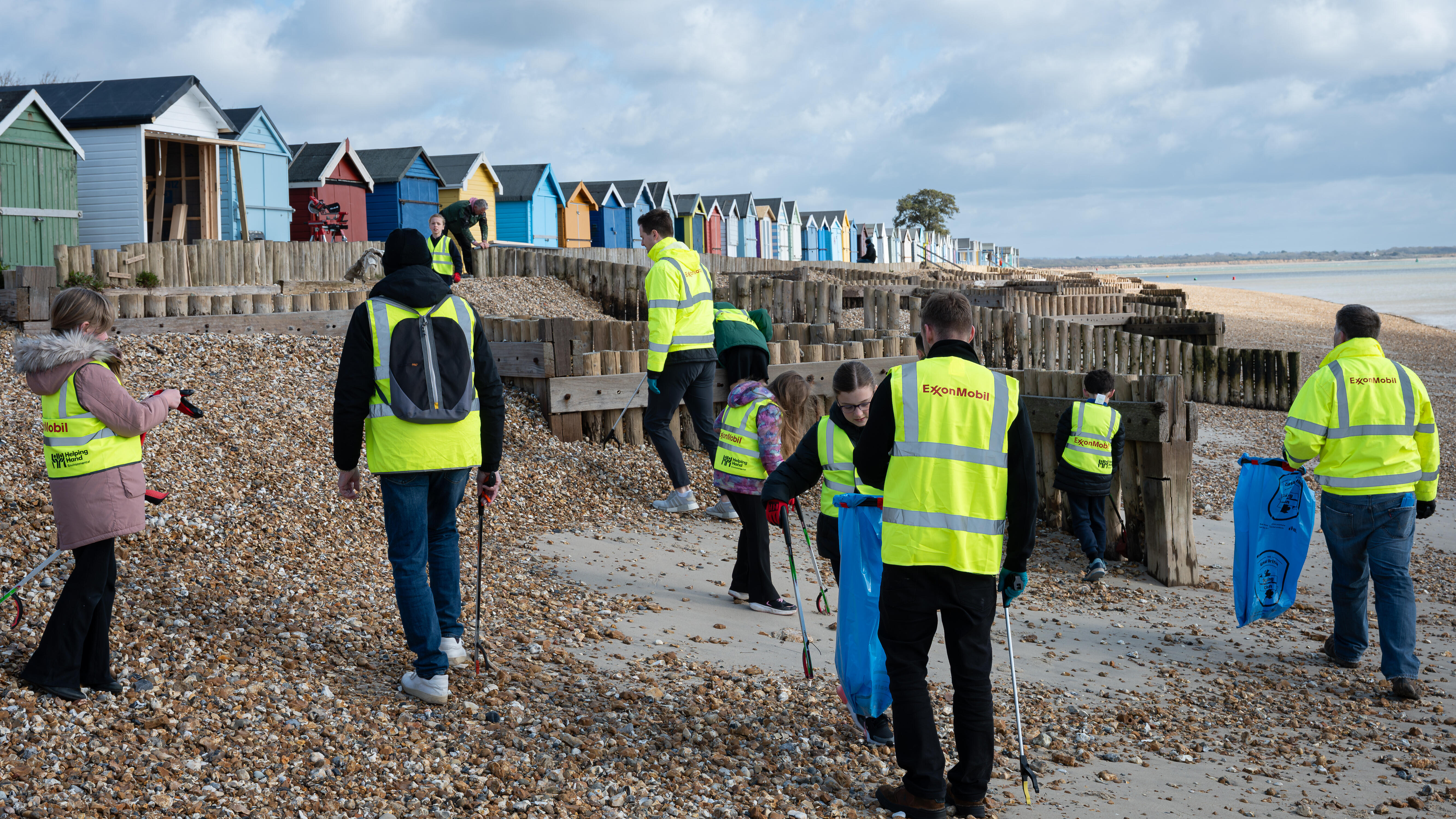 ExxonMobil Fawley employees and local students cleaning up Calshot Beach