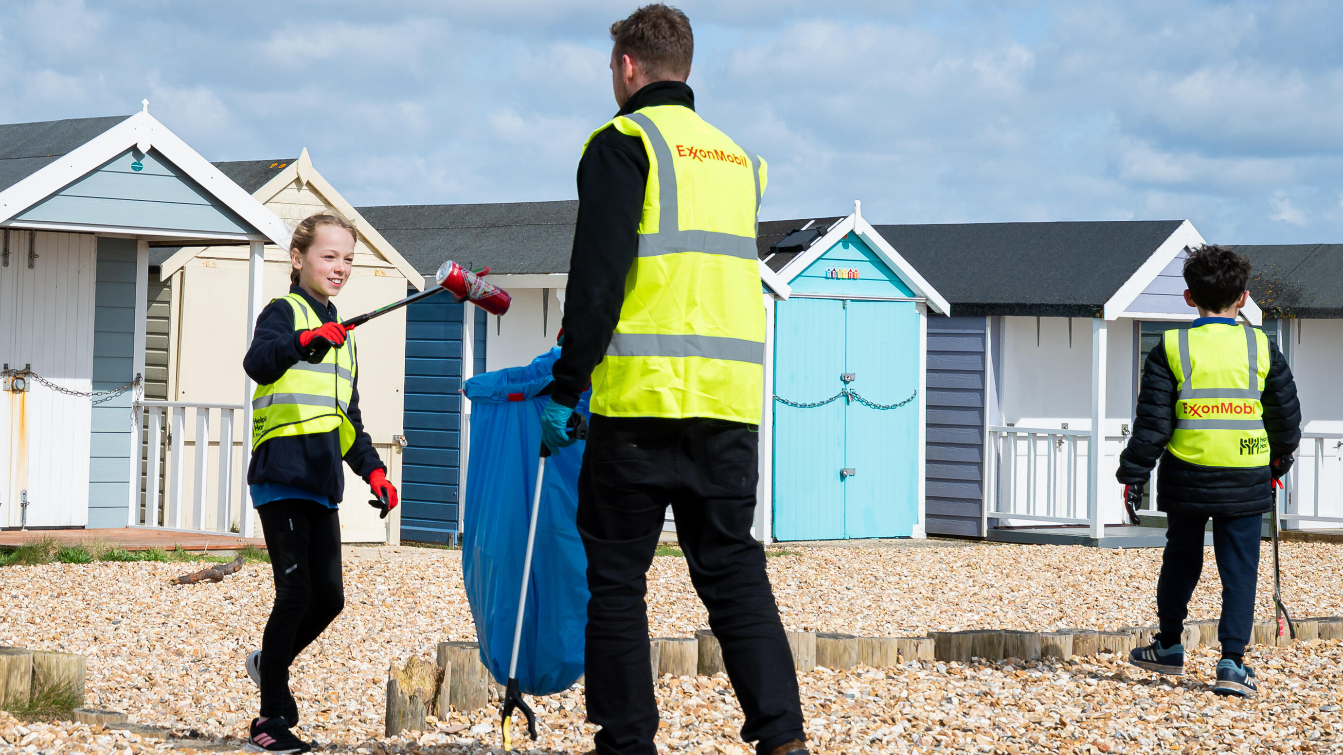 ExxonMobil Fawley employees and local students cleaning up Calshot Beach
