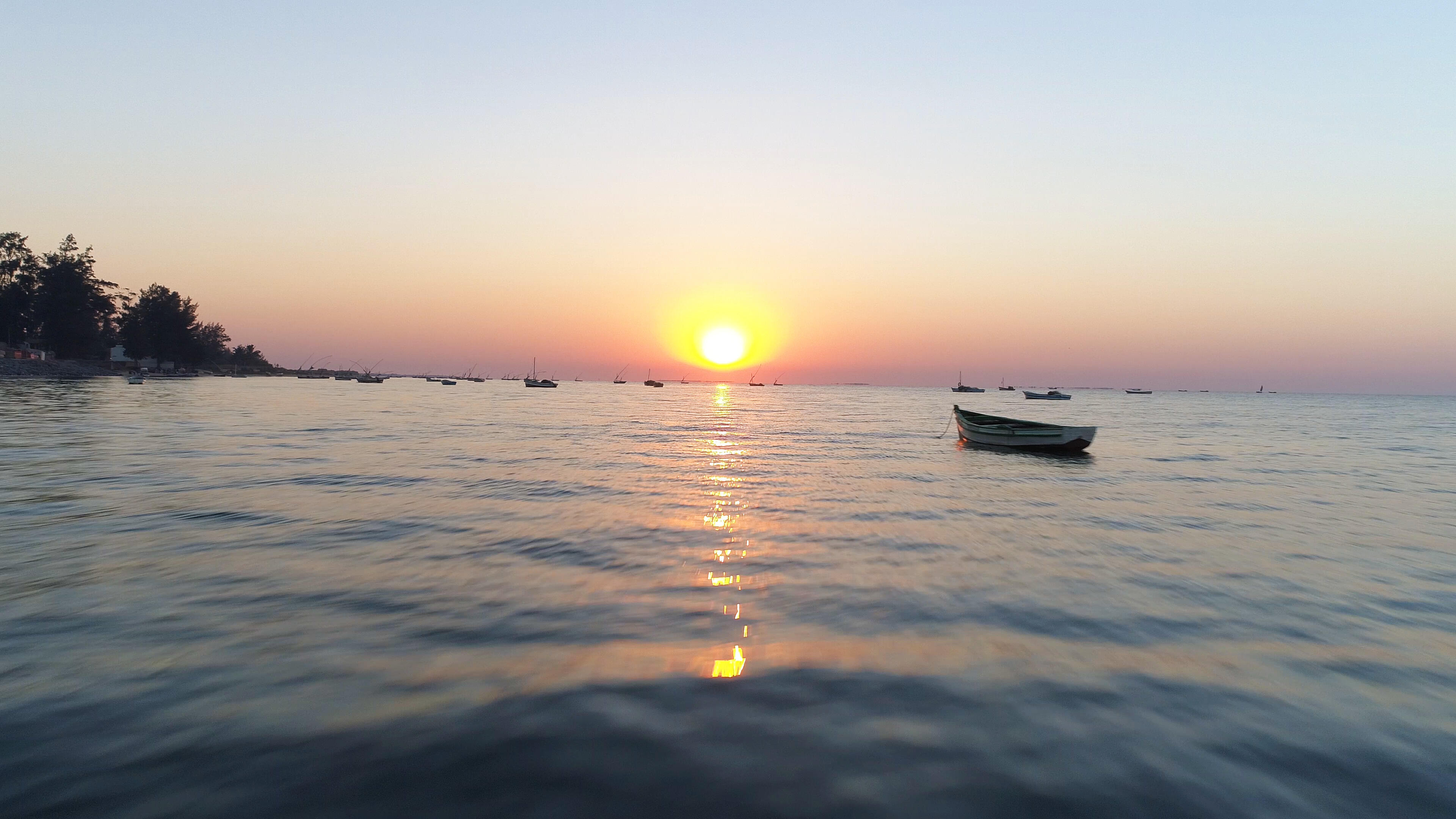 small wooden fishing boats moored in a bay or harbor