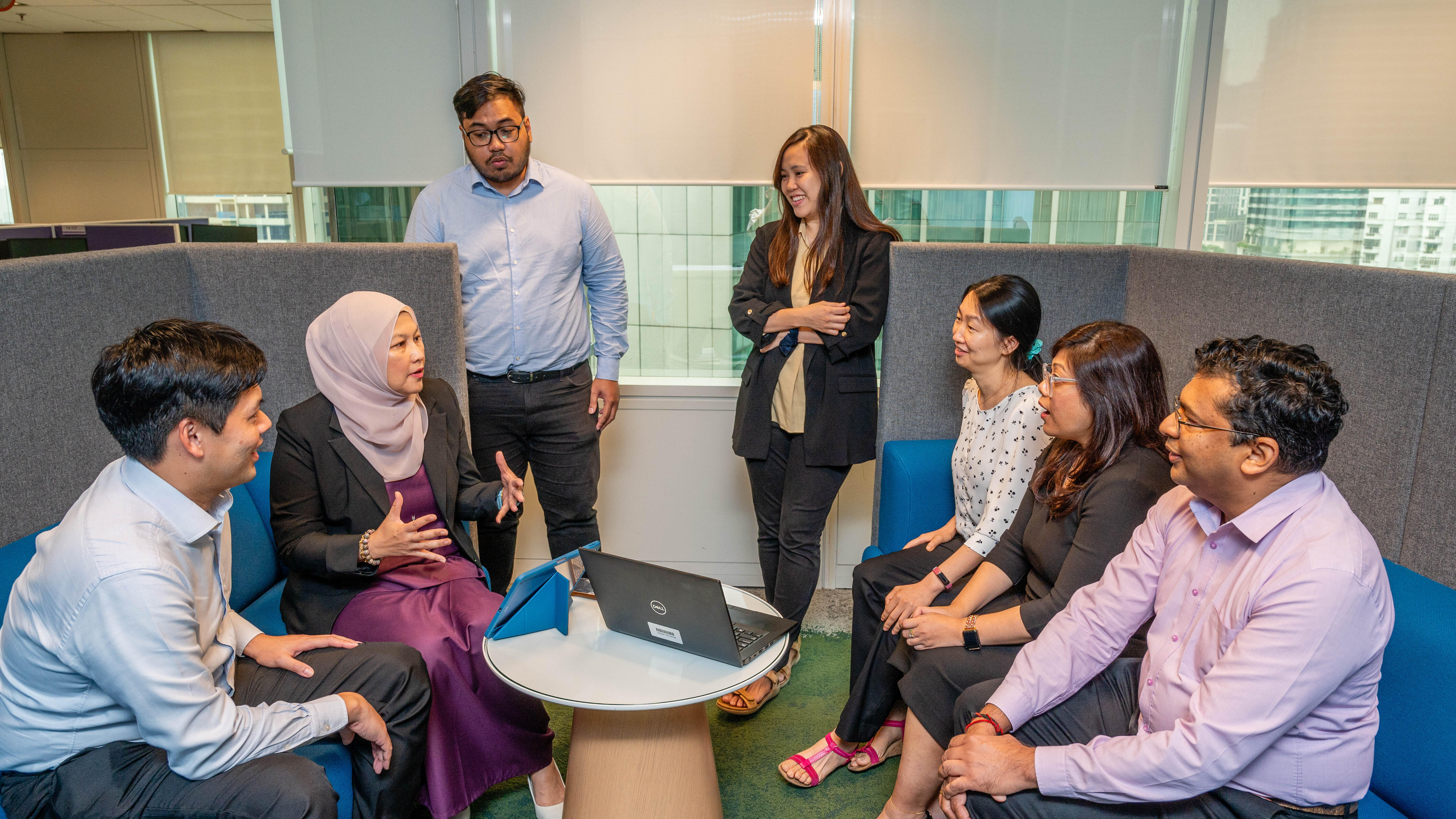 ExxonMobil employee, Adelina, meeting with a group of Malaysian employees