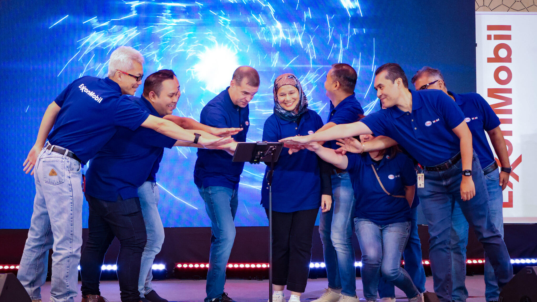 ExxonMobil employees celebrating the launch of Malaysia's Kuala Lumpur Global Business Center