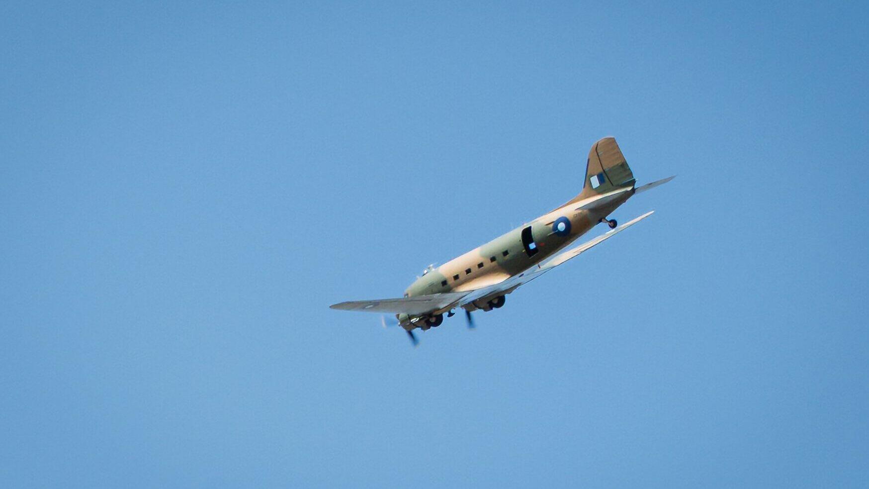 military plane in flight over Six Villages Together Festival sponsored solely by ExxonMobil Fawley