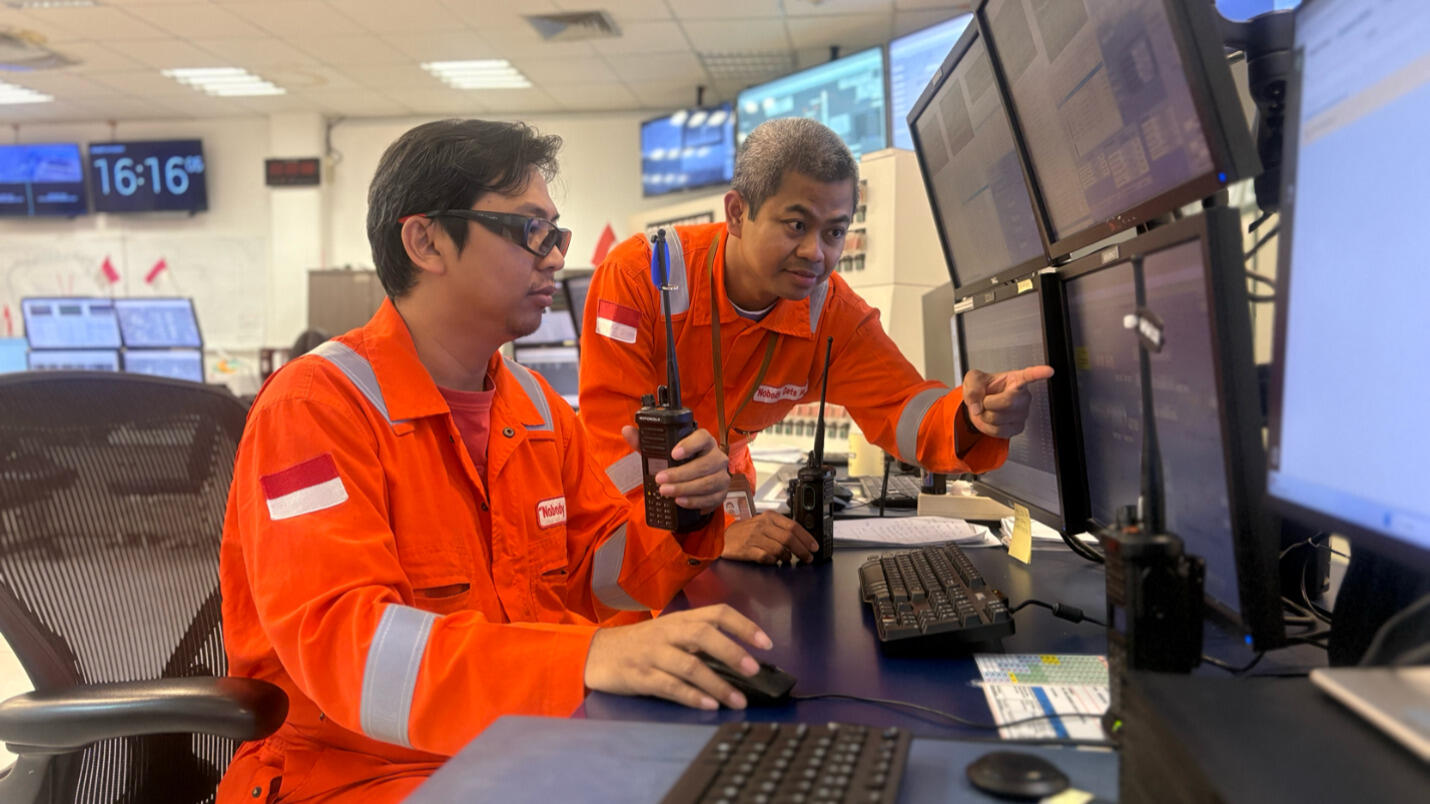 employees in a control room