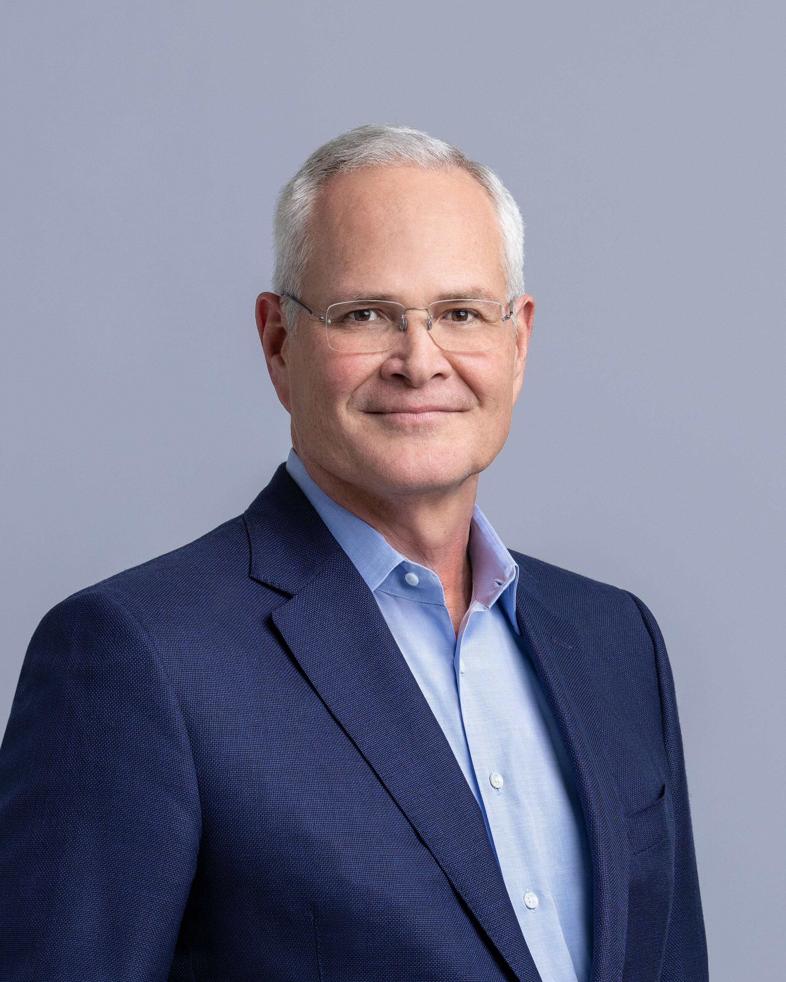 Professional headshot of Darren W. Woods.