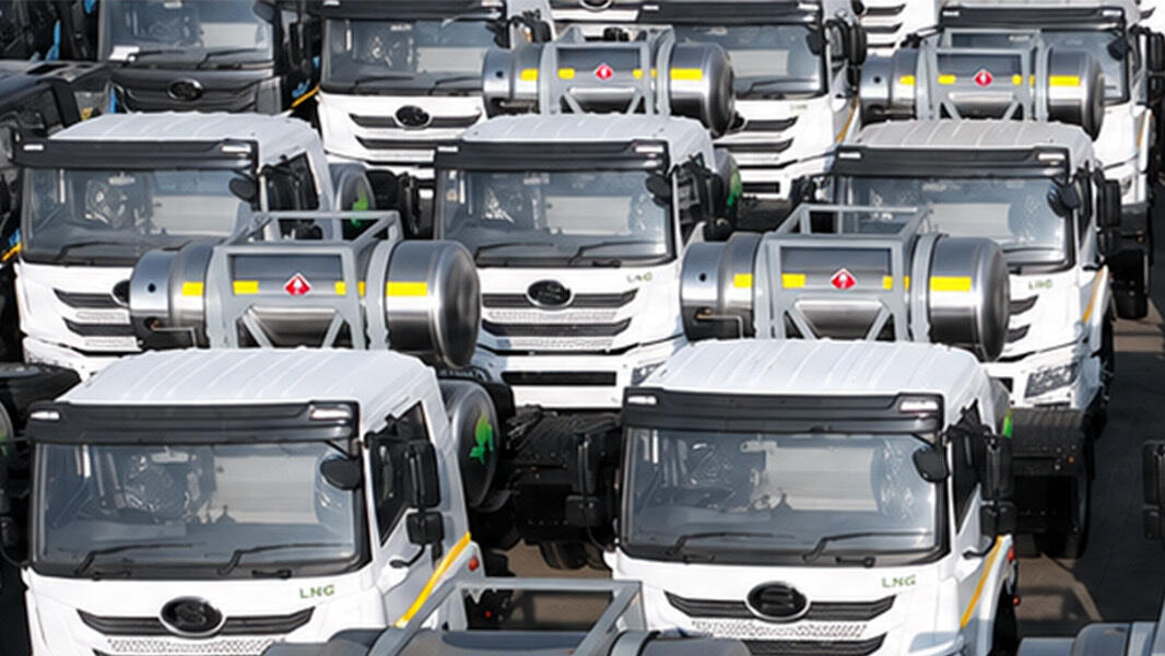 rows of LNG-powered heavy-duty trucks