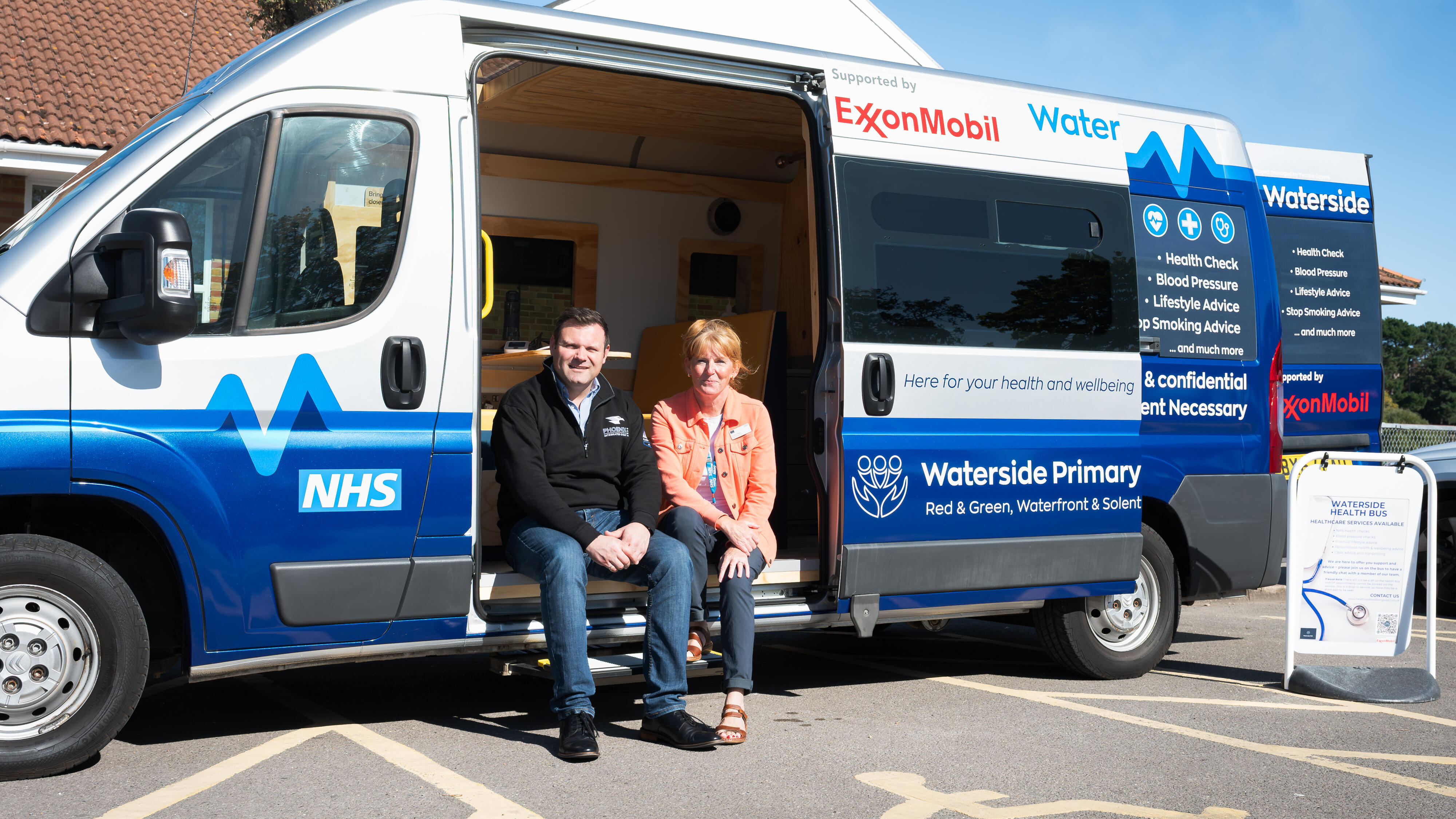 ExxonMobil Fawley's Joel Mizen and Waterside's Yvonne Sayers sitting in mobile health unit