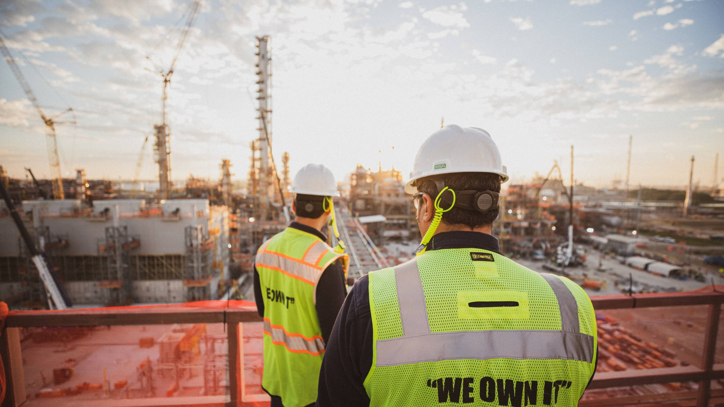 Two ExxonMobil employees overlooking facility at Baytown