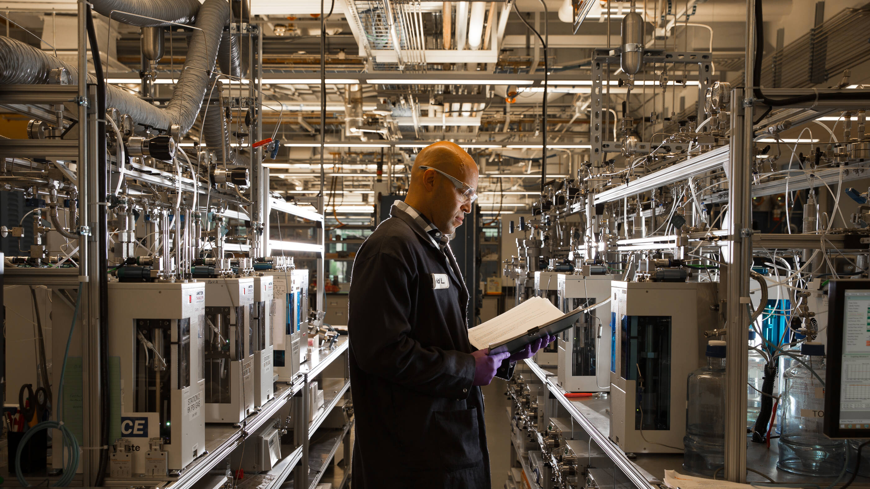 Man in lab wearing safety goggles