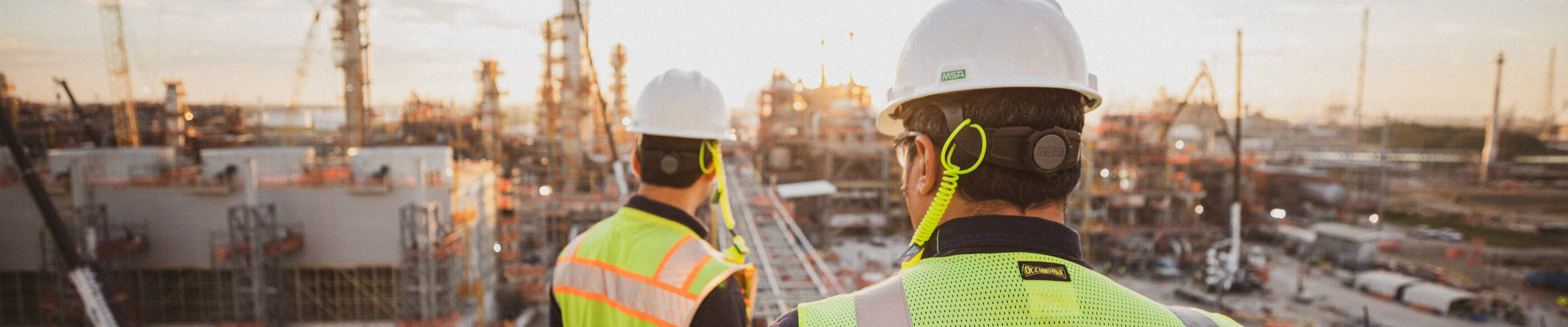Two ExxonMobil employees overlooking facility at Baytown