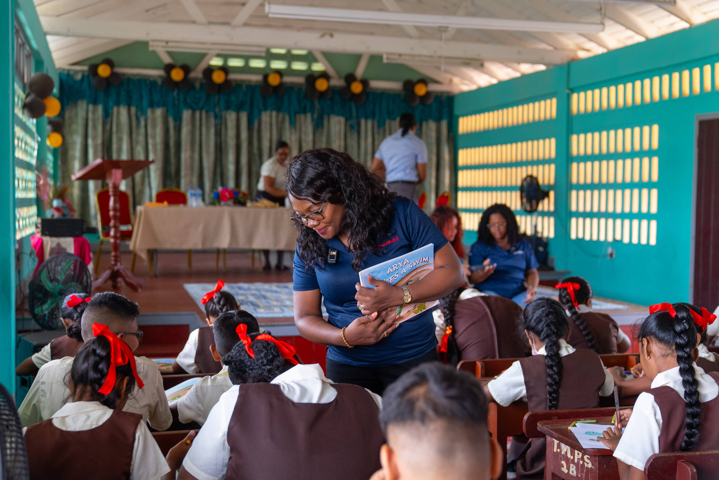 ExxonMobil Guyana employees interact with students on World Turtle Day.