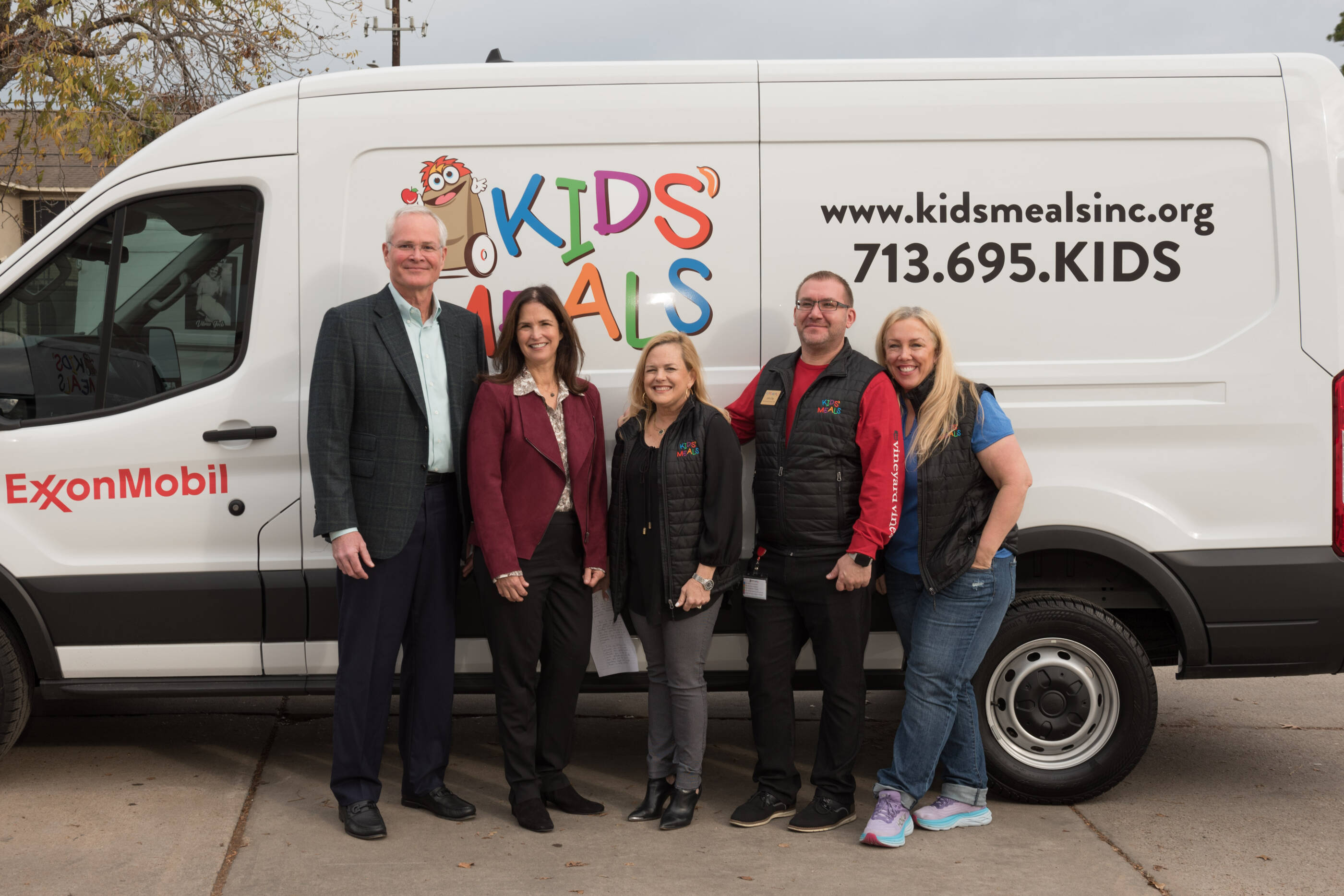 ExxonMobil President, Darren Woods with the Kids Meals van