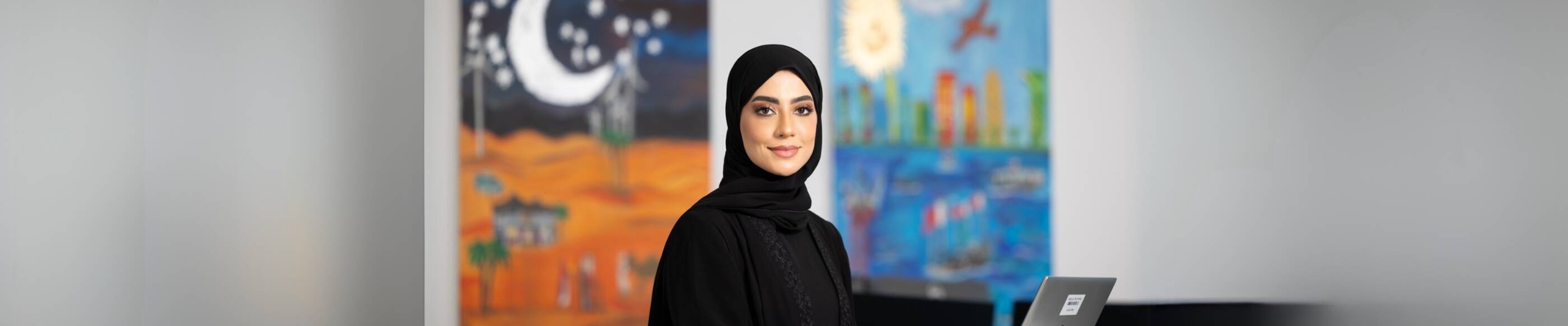 Noora Musa working in an office