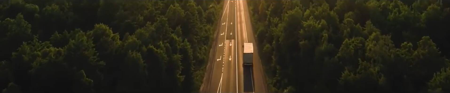 Truck driving down a highway