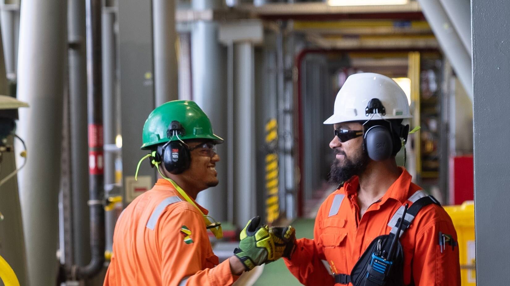 Two ExxonMobil Guyana employees working on the Liza Destiny