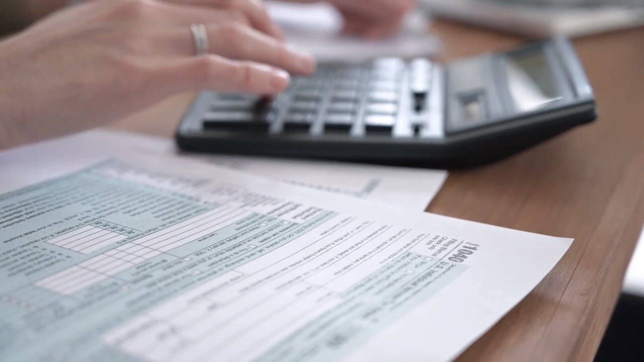 Calculator and forms on desk