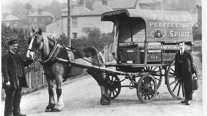Image In 1910 a horse drawn van used by the Anglo-American Oil Co. for the delivery of 2-gallon cans of petroleum spirit on the Isle of Wight.
