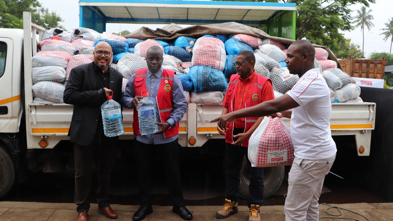 local team members delivering water