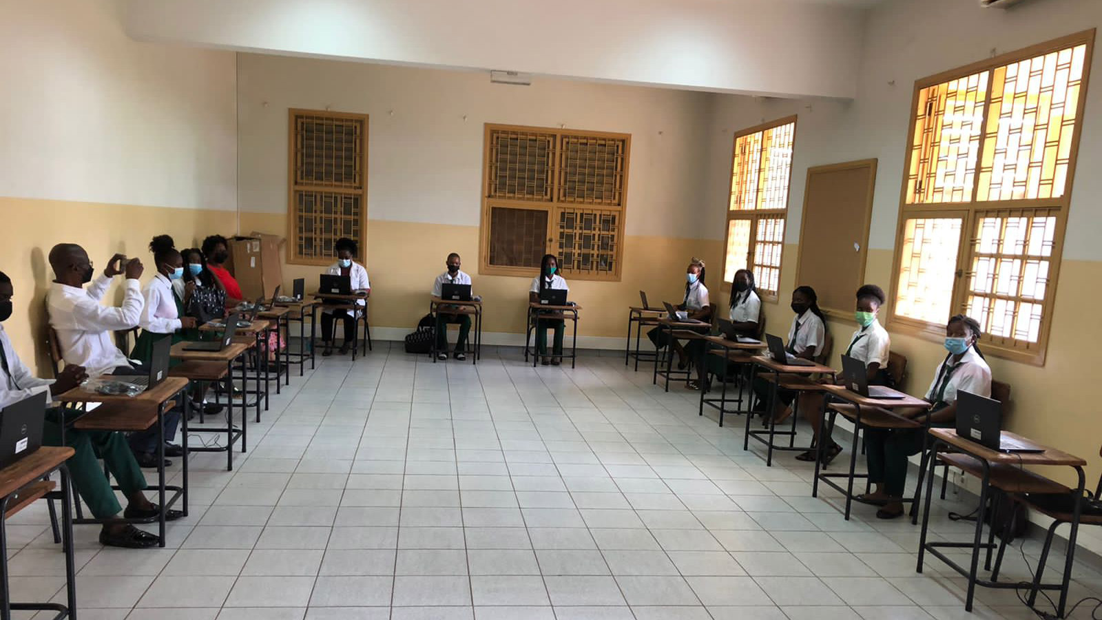 classroom of students with laptops