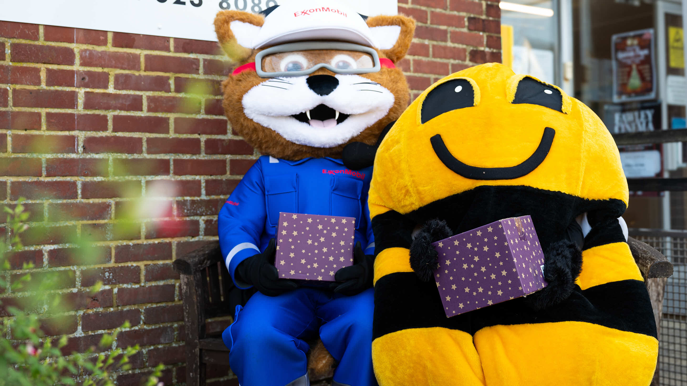 mascots with Christmas hampers