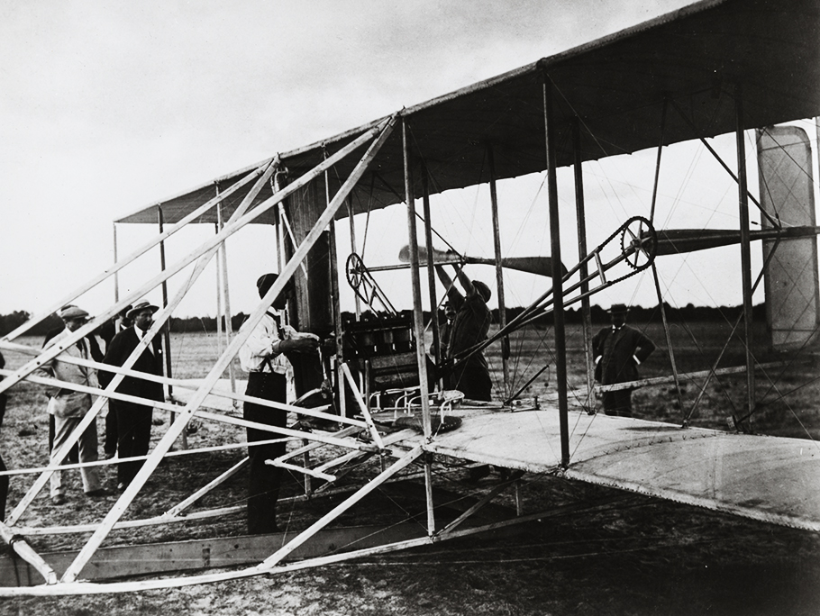 The Wright brothers with plane model