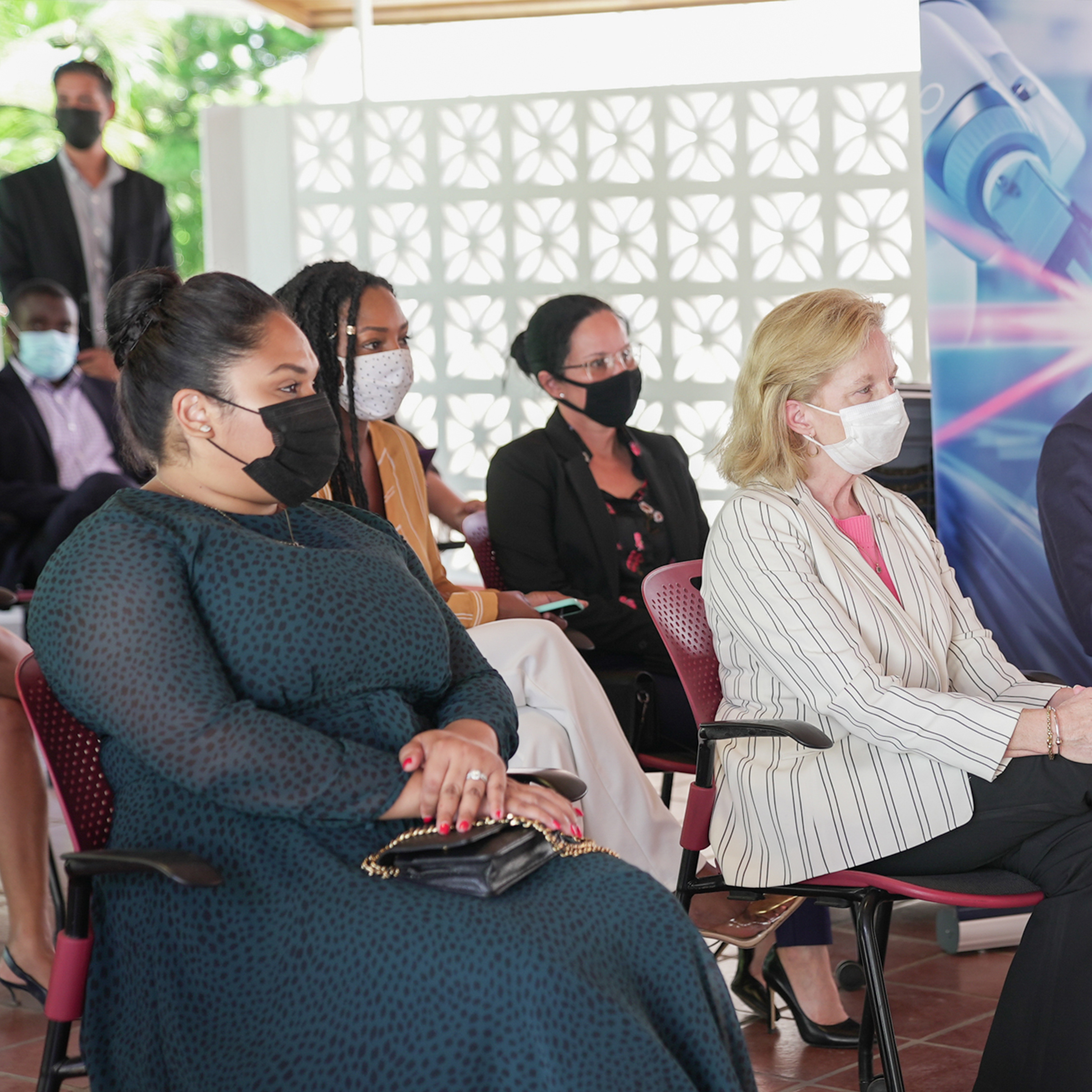 Image Guyanese First Lady Aril Ali (l) sits beside U.S. Ambassador to Guyana Sarah-Ann Lynch and Esso Exploration and Production Guyana Limited Lead Country Manager Alistair Routledge at a 2021 event launching the HerVenture business app for women, which was developed by the Cherie Blair Foundation for Women in partnership with the ExxonMobil Foundation.