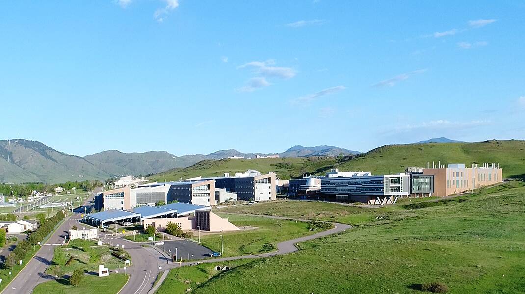 Landscape image of NREL campus with mountains in the background