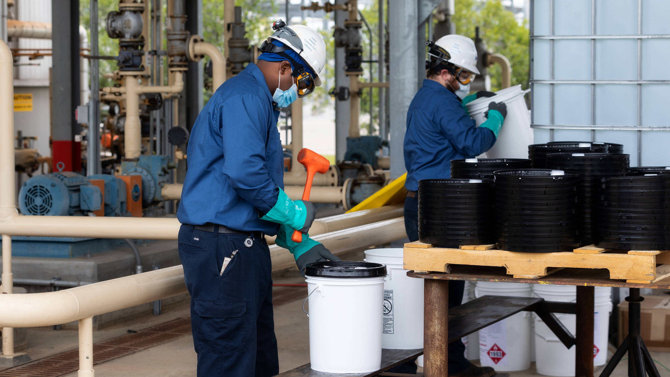 To enhance safety, ExxonMobil plant personnel package the sanitizers outdoors. The new manufacturing process upholds all safety requirements and the consumer-ready product meets FDA standards.