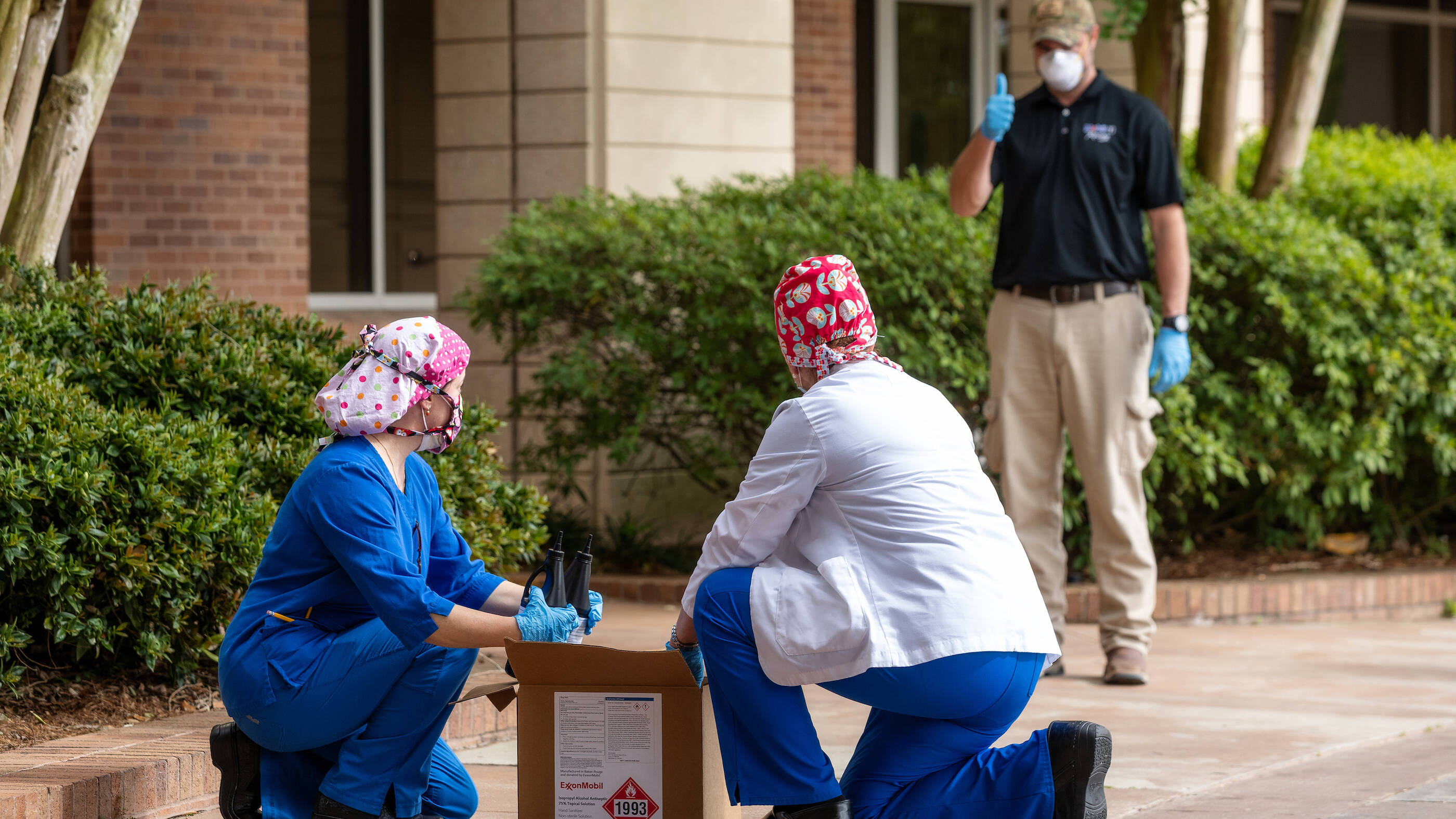 ExxonMobil employees at facilities across the country have shifted their workdays to deliver sanitizers to the front lines. Ryan Beissinger maintains social distancing during a delivery at Baton Rouge General Hospital.
