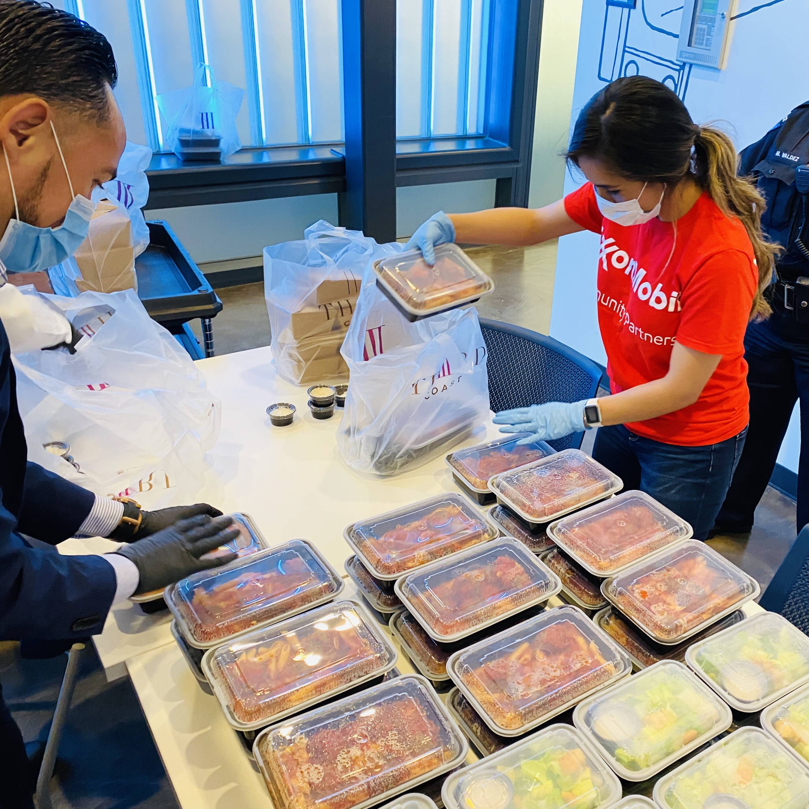 Image ExxonMobil volunteers worldwide helped distribute food to local communities affected by the COVID-19 pandemic.